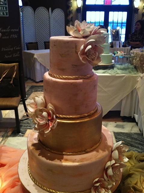 Blush cake with gold painted accents…stunning. Oak Mill Bakery