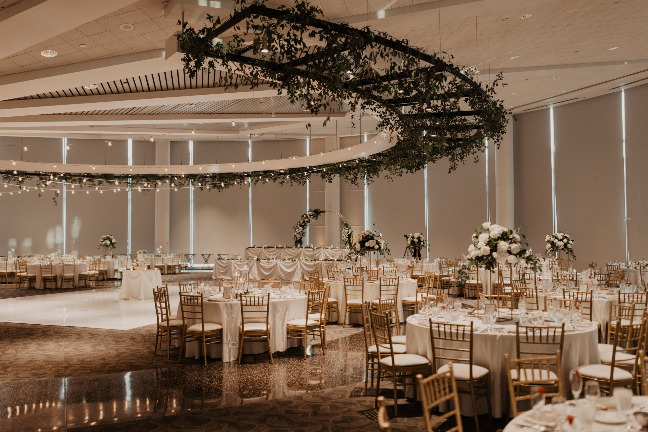 Elegant_Event_Lighting_Chicago_Wedding_Esplanade_Lakes_By_Double_Tree_Downers_Grove_White_Vinyl_Dance_Floor_Cafe_Lights_Greenery_Black_Ring_Dancing_Guest_Tables_reception-scaled.jpg